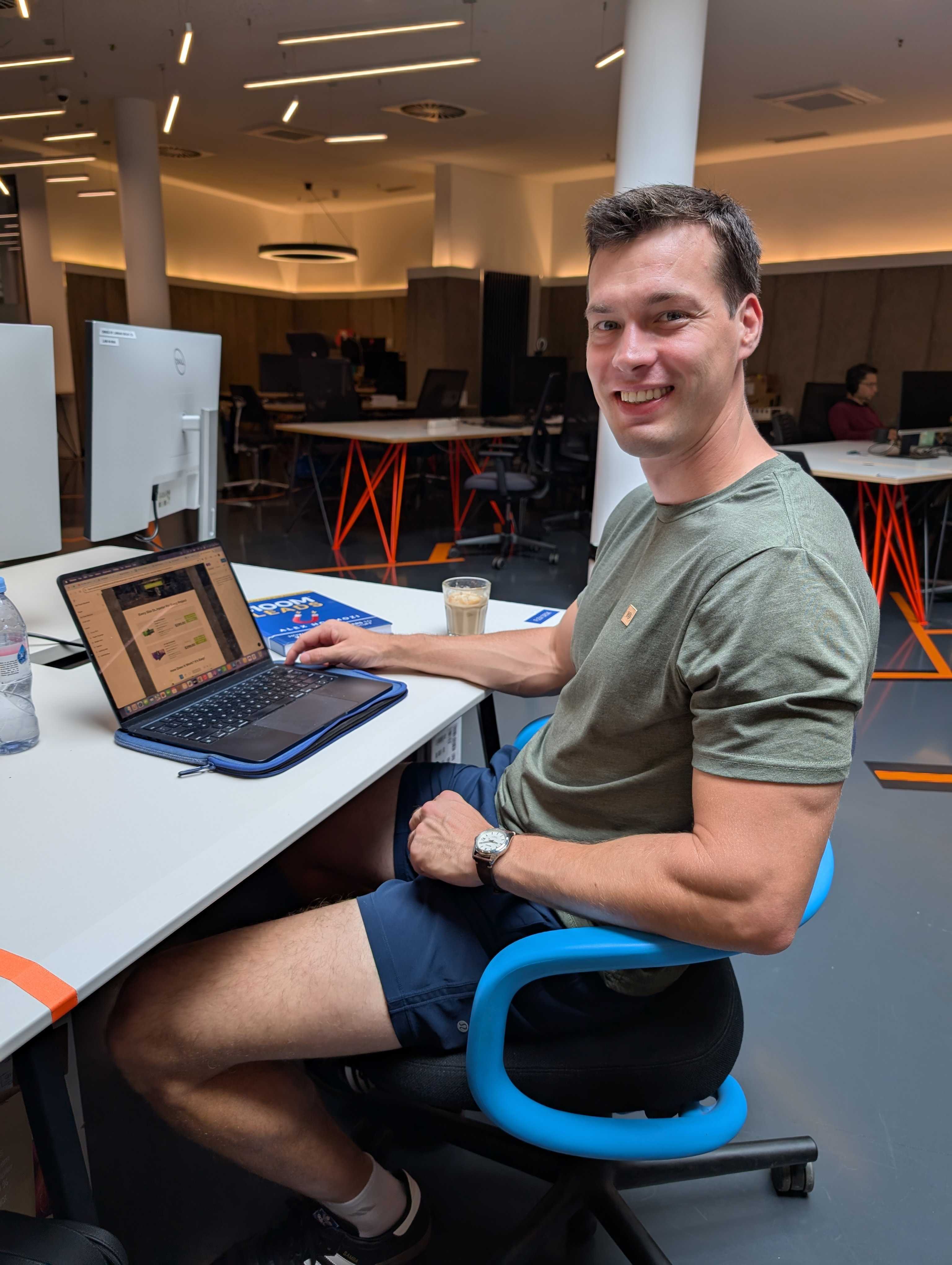 Adam Spence working on his laptop